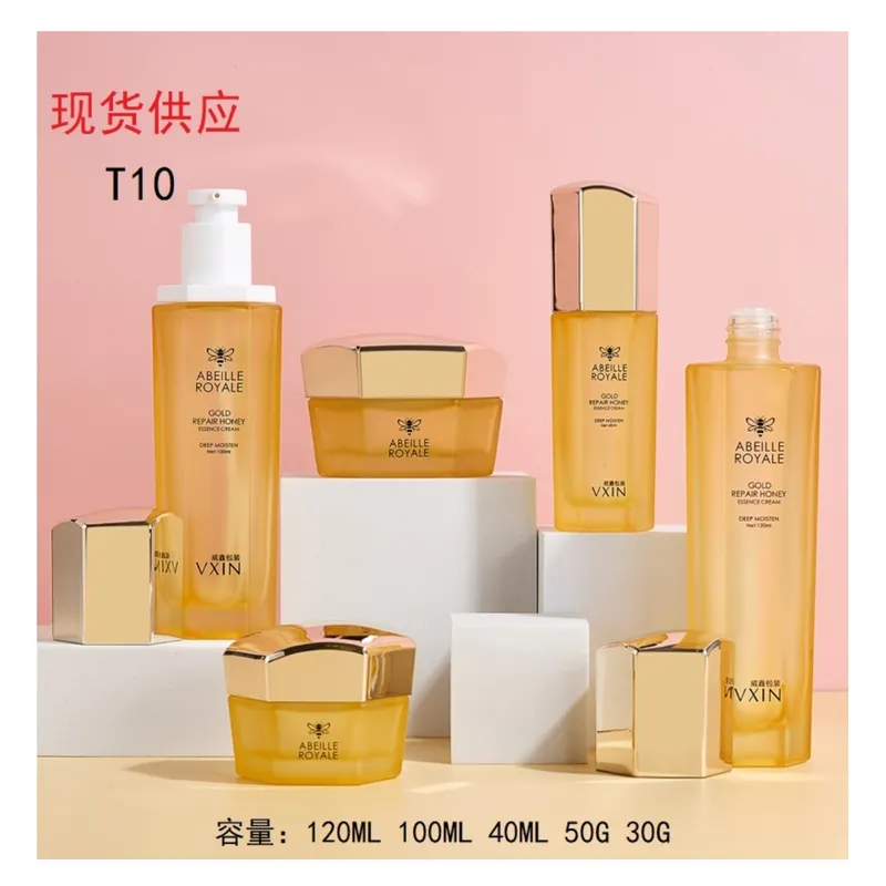 Bộ chai + hũ thủy tinh vàng cam nắp vàng lục giác T10 – mã NXG0475