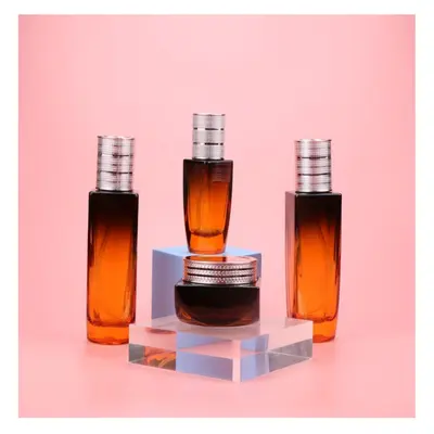 Bộ chai + hũ thủy tinh cam nâu chuyển màu nắp bạc – mã NXG0575
