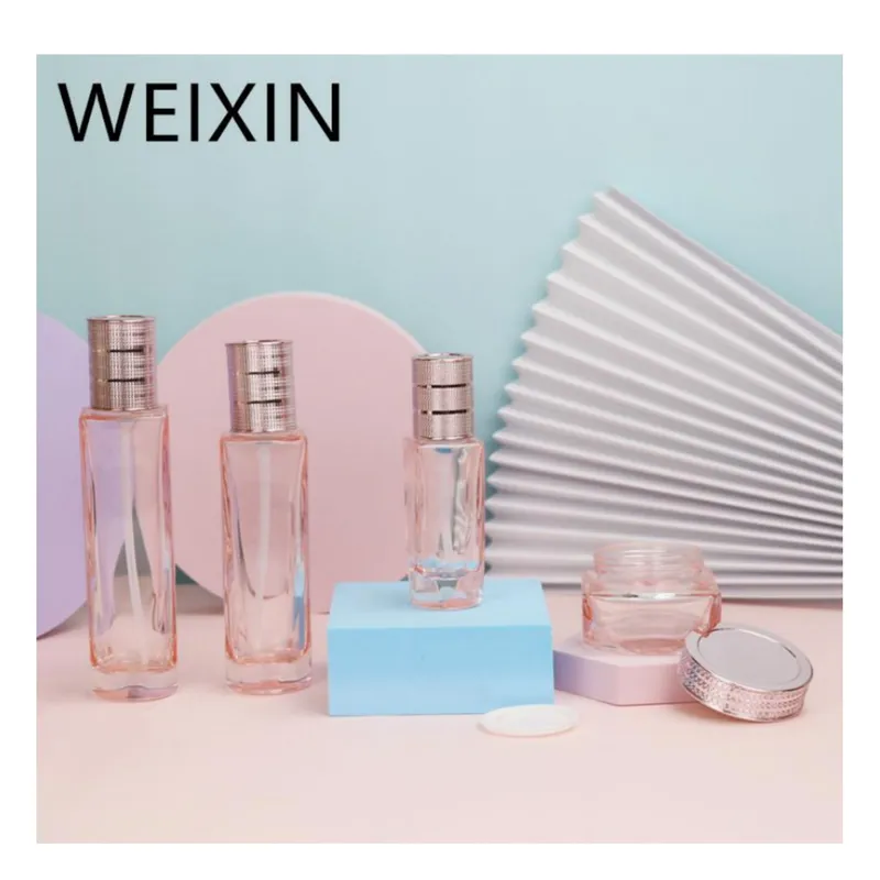 Bộ chai + hũ thủy tinh hồng trong nắp vàng hồng – mã NXG0588