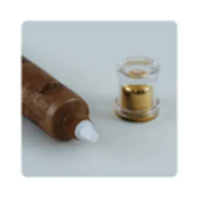Tuýp nâu nắp acrylic lõi vàng – mã NXT1160