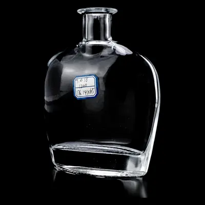 Chai rượu thủy tinh dẹt vai tròn 500ml – mã NXW0001